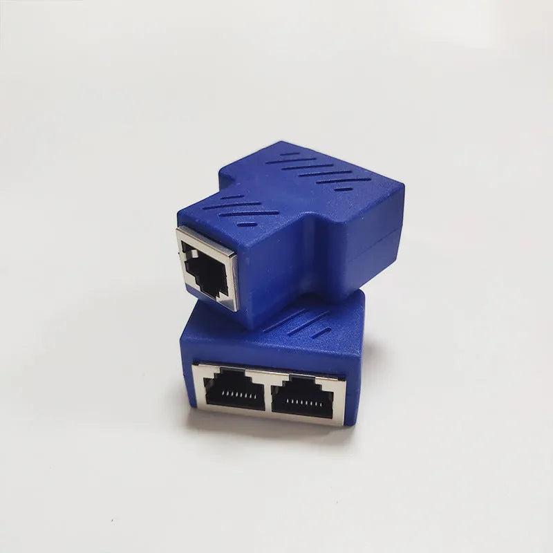 White RJ45 network cable tee splitter adapter on a dark background