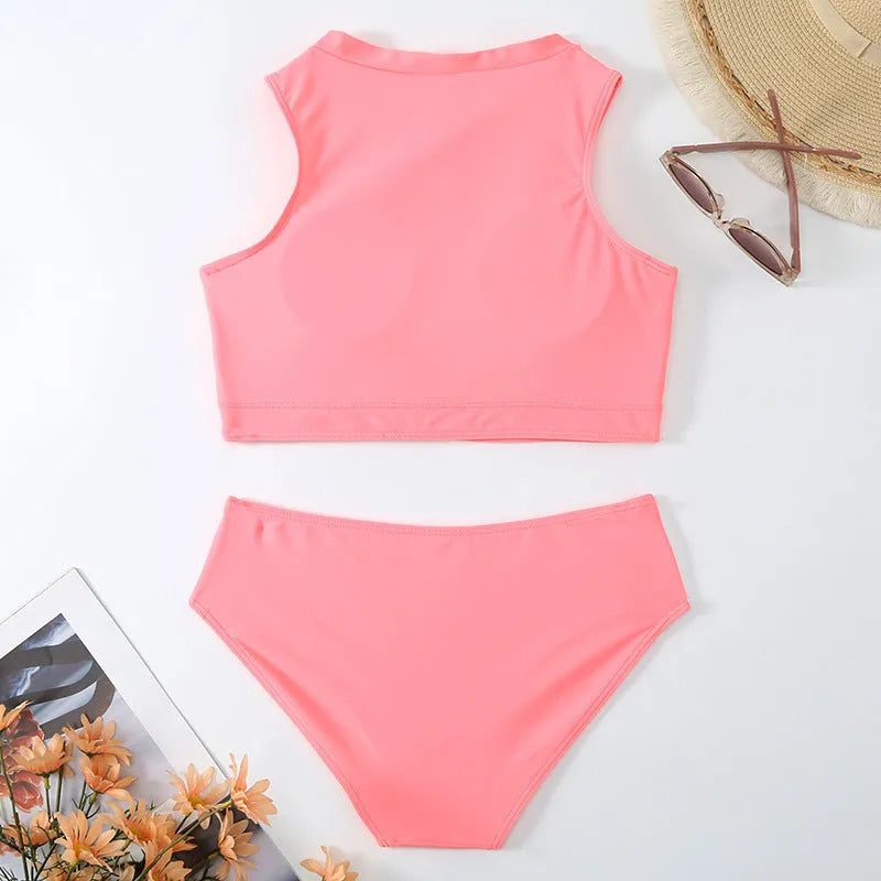 Pink high waisted women's bikini swimsuit with briefs and sleeveless top on mannequin