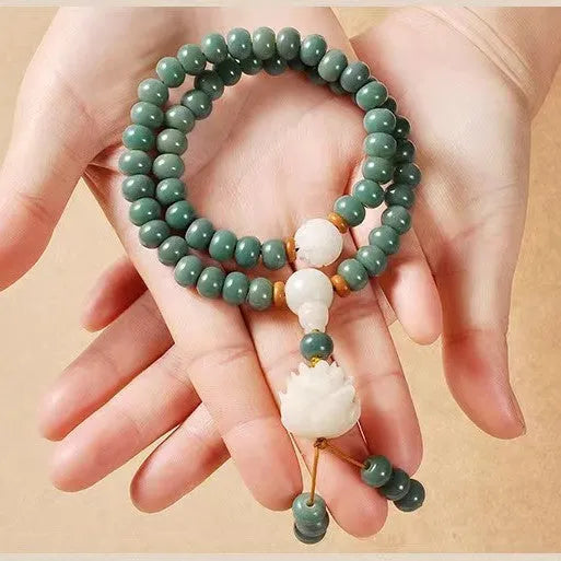 White Jade Bodhi Green Sandalwood Bracelet with Bodhi seed beads, lotus charms, and a double ring safety clasp.