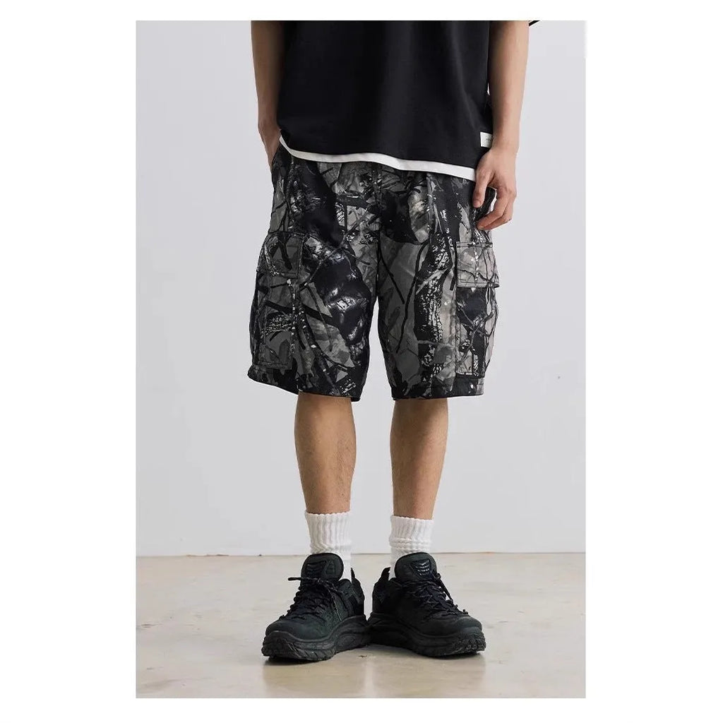 Loose casual straight-leg denim shorts in army green with a zip fly and elasticated waistband.