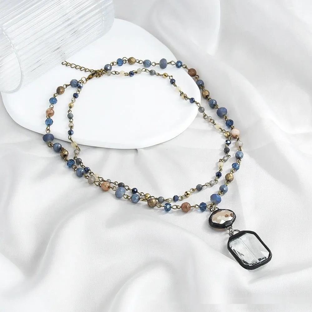 Tribal style layered necklace with natural stone and glass pendant on adjustable chain