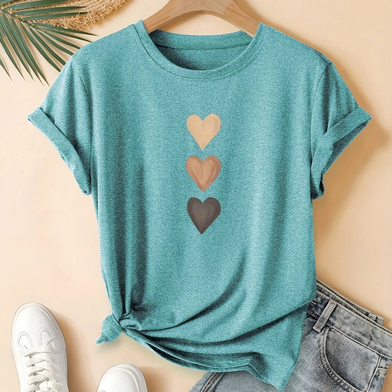 Women's art retro style printed cotton short sleeve T-shirt on a hanger.
