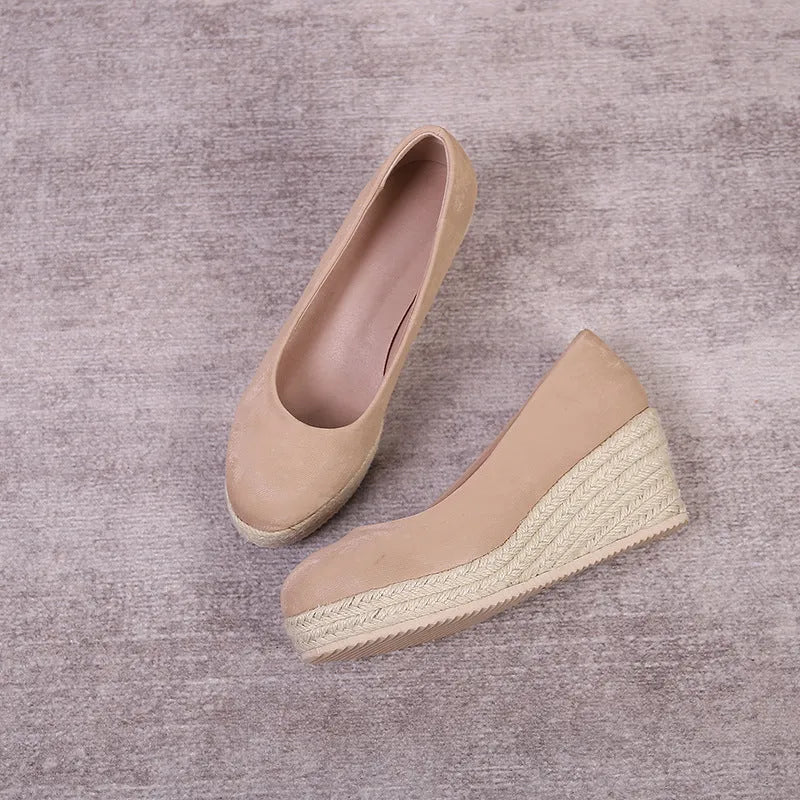 Apricot wedge heel pumps with a thick sole and rope-strap detail across the shallow mouth.