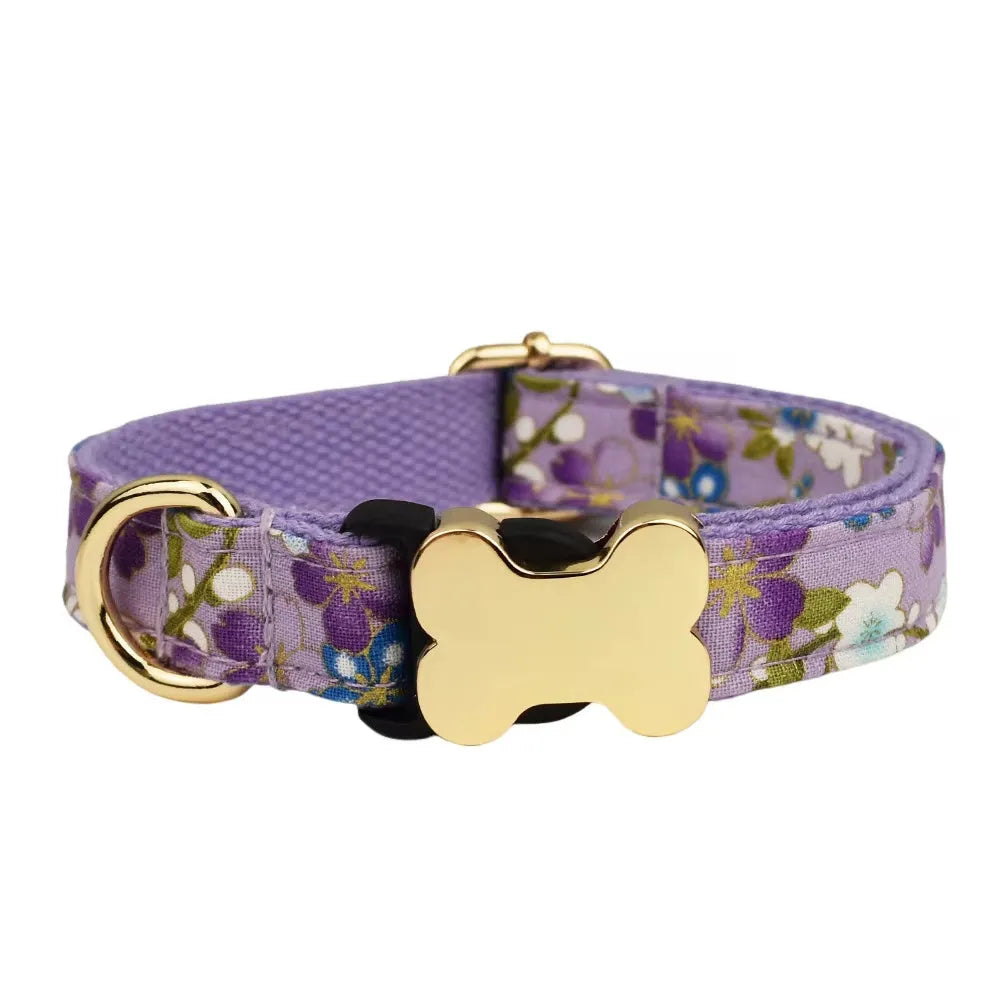 Flat nylon dog collar with a printed grid pattern and a central bone-shaped metal buckle.