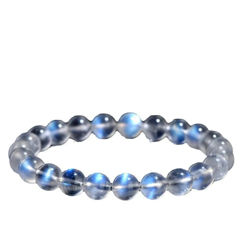 Natural cream crystal bracelet with blue moonlight design and polished beads