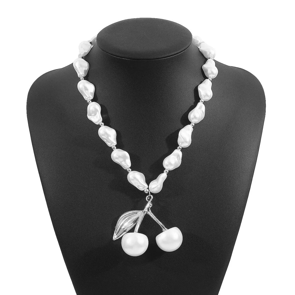 Geometric fruit pendant necklace with pearl chain in gold finish, measuring 51-60cm circumference