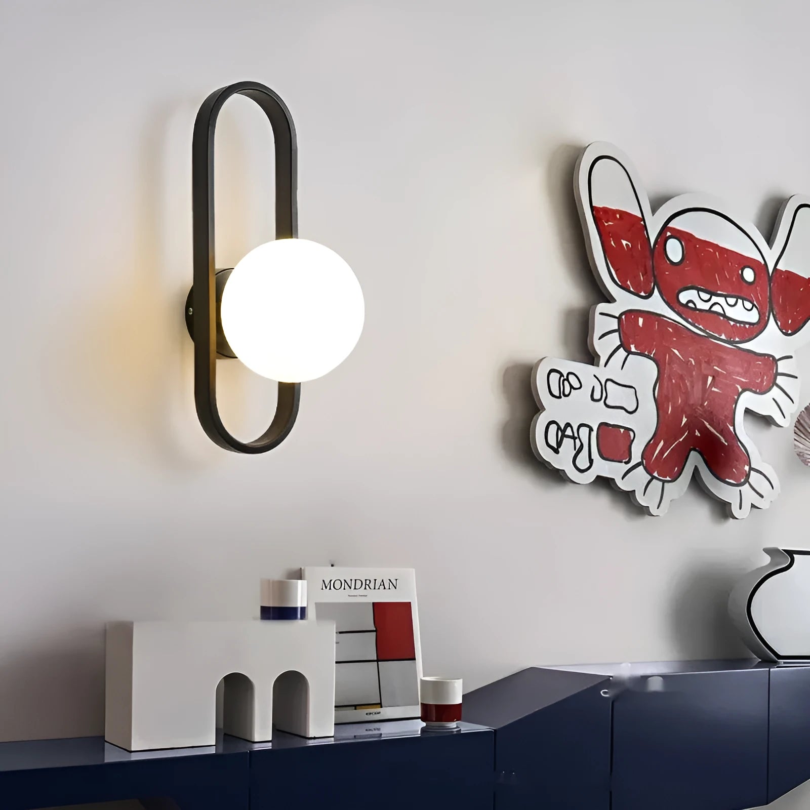 Minimalist wall lamp with glass shade and iron body in black or gold finish showing 12W tri-colour light source