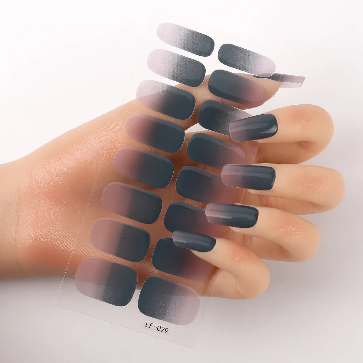 Full nail art sticker sheet showing 16 different solid colour designs including European simple nails and floral patterns