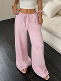 Women's wide-leg black trousers with a lace-up detail on the mid-rise waistband.