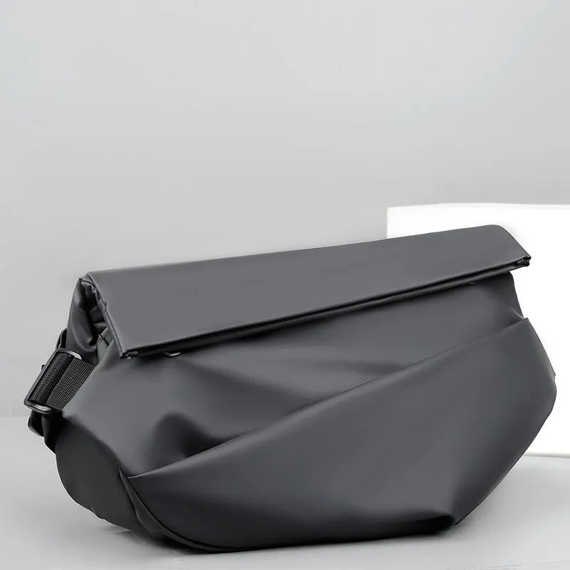 Grey PU crossbody bag showing front zipper compartment and adjustable shoulder strap