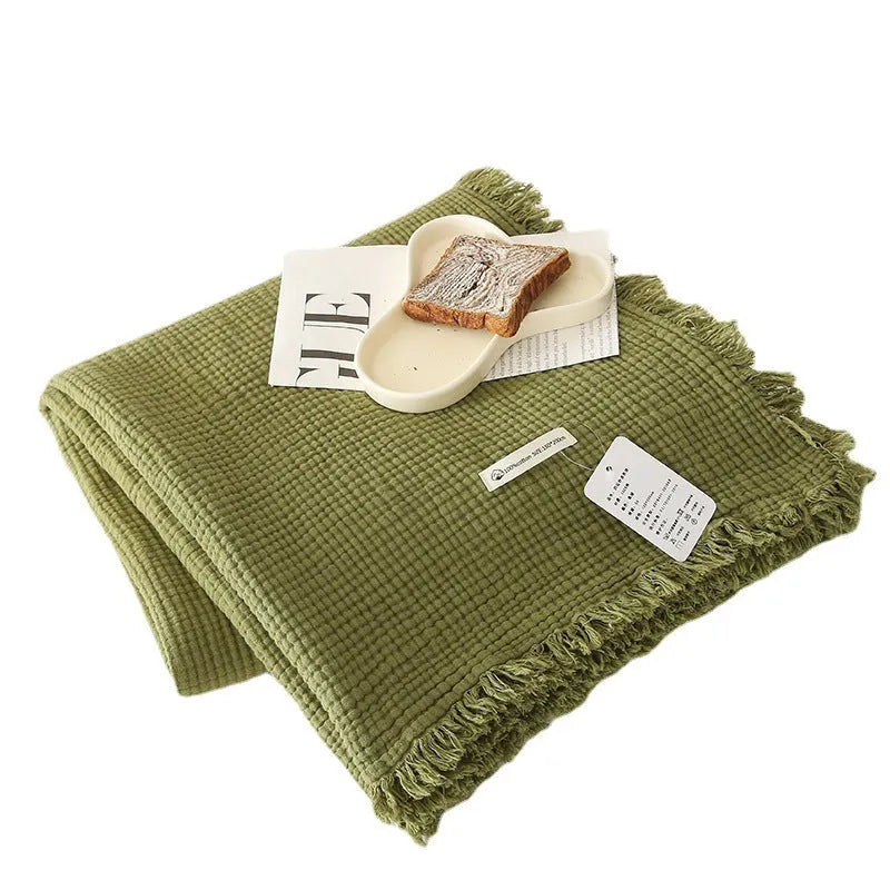 Four-layer gauze cotton blanket with tassel detailing in navy blue colour option