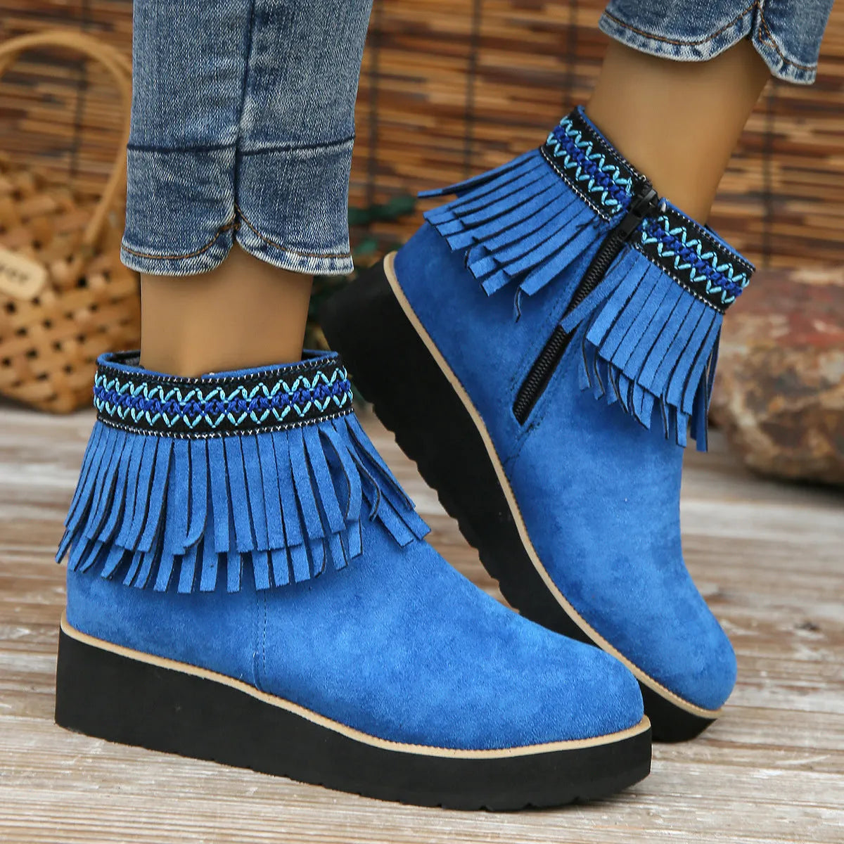 Women's dark brown suede wedge ankle boot with side zip, tassel, and thick rubber sole.