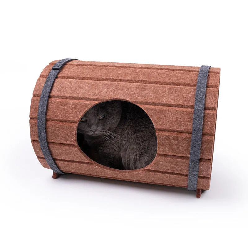 Assembled grey felt wine barrel-shaped pet bed for cats and small dogs.