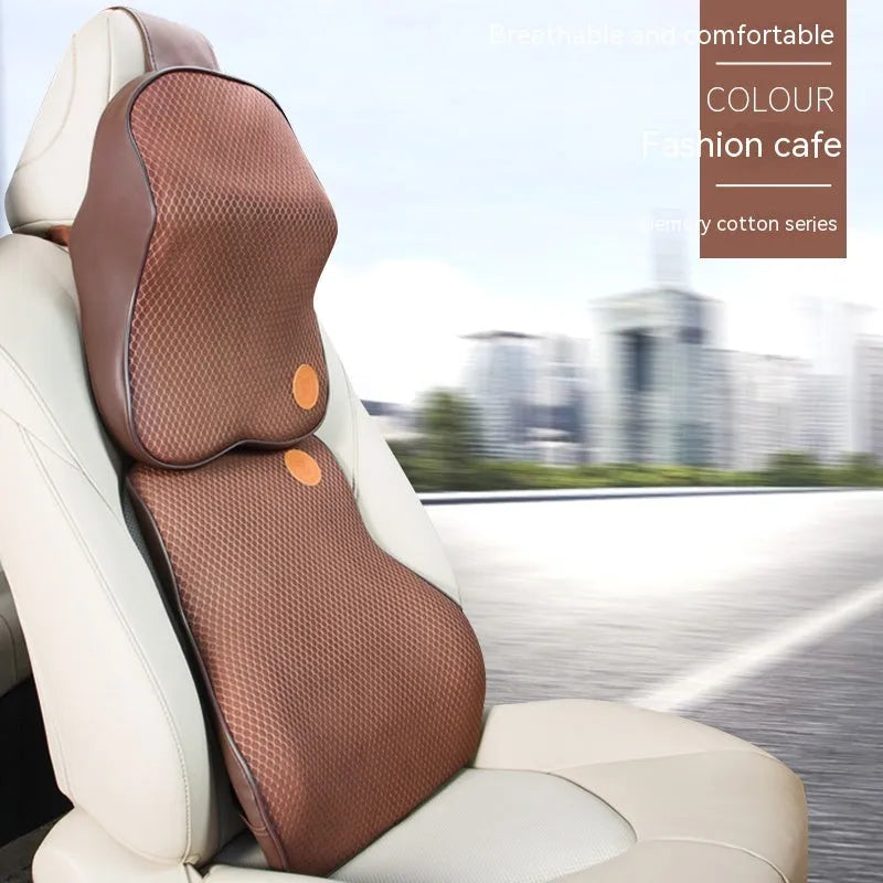 Black and brown memory foam car headrest pillow and lumbar support cushion set on a car seat.