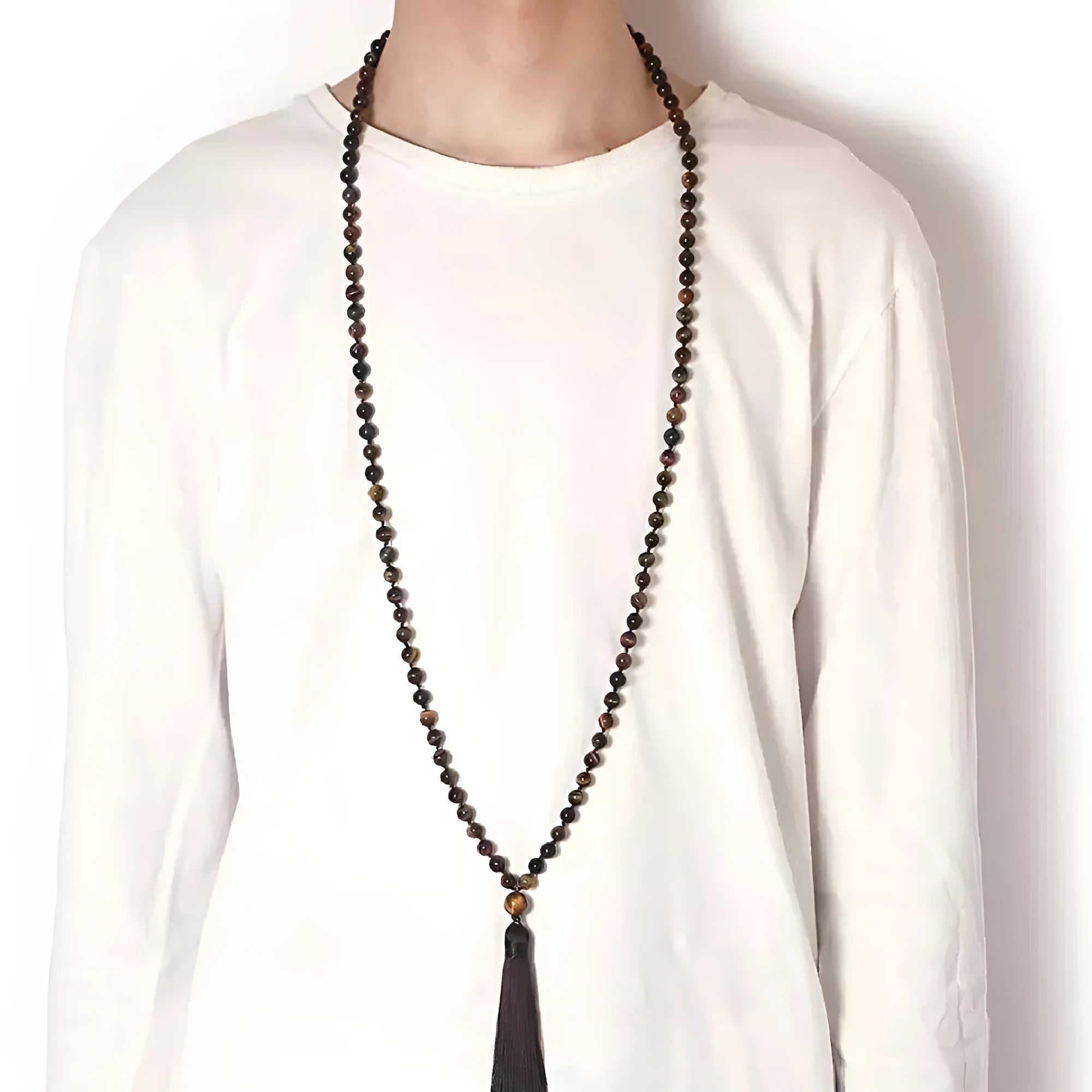 Long multi-strand agate tassel necklace with geometric pattern of amethyst, lapis lazuli, and blue stone beads.