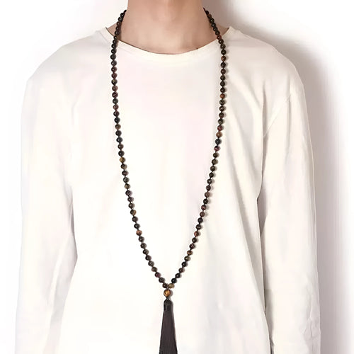 Long multi-strand agate tassel necklace with geometric pattern of amethyst, lapis lazuli, and blue stone beads.