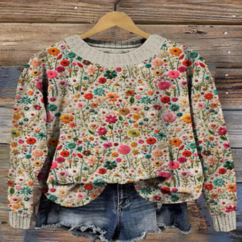 Women's round neck sweater with a small digital floral print in a solid colour.