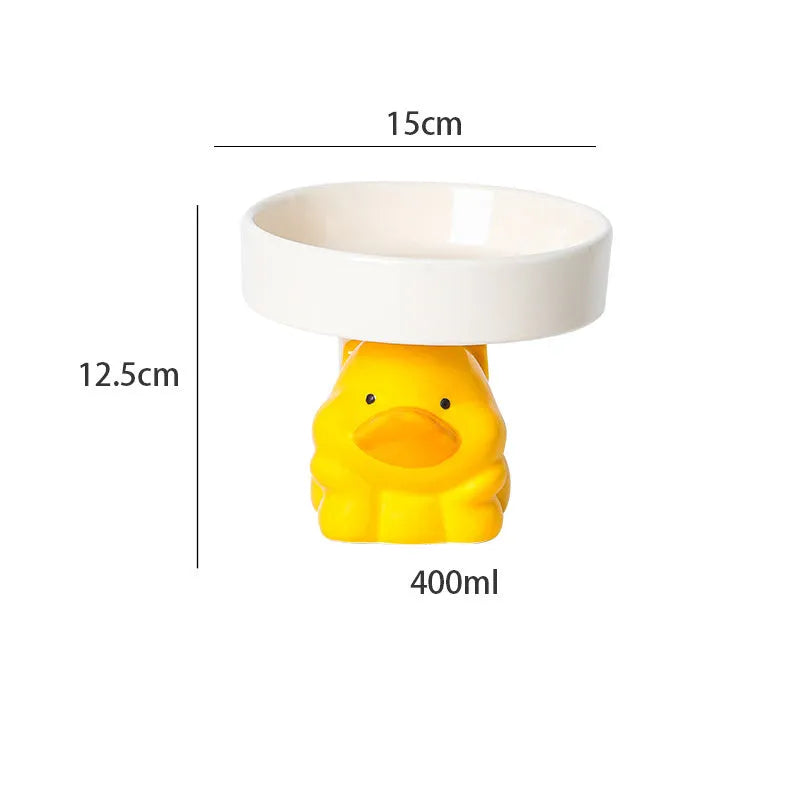 White ceramic raised cat bowl with bear design, showing wide opening and elevated base.