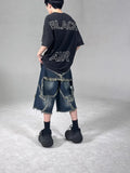 Blue denim shorts with frayed detailing and five-pointed star design in loose fit