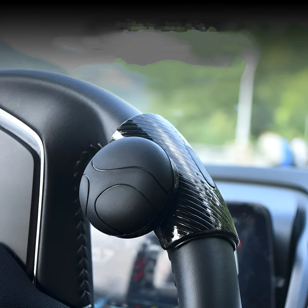 Black silicone steering wheel assist ball with metal bearing mechanism for single hand driving
