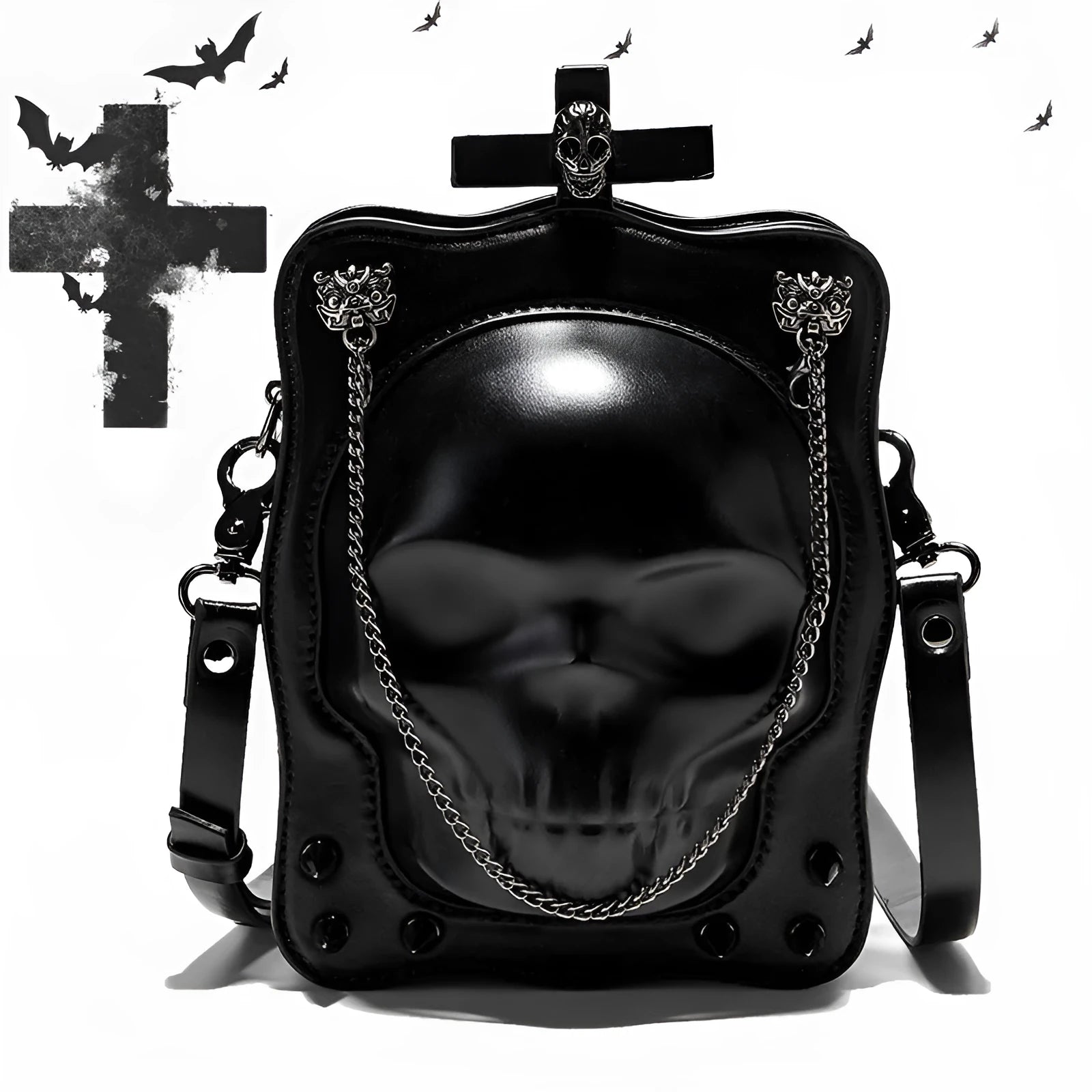 Black mini square crossbody bag with skull embossing, chain detail, and metal rivets on a vertical PU leather messenger bag.