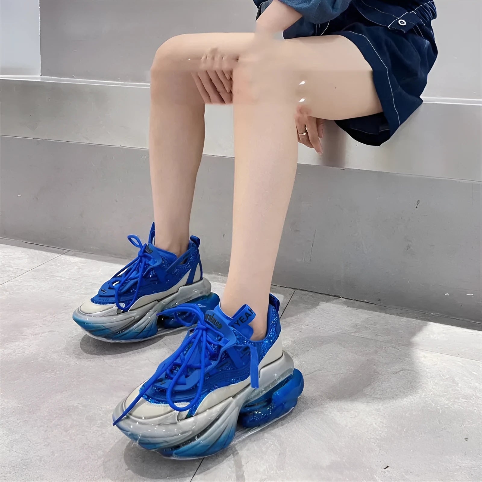 Women's leather casual sports shoes with thick jelly sole and cross-tie design in assorted colours.