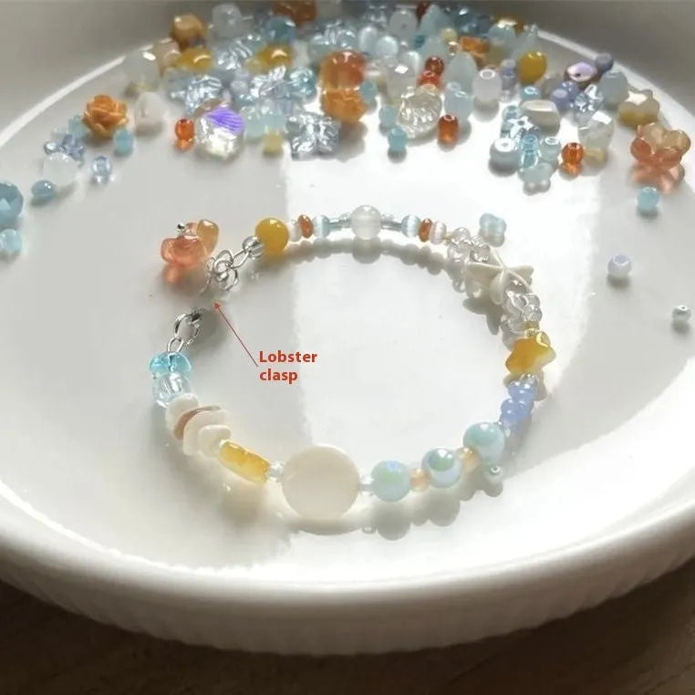 Orange sea colour alloy bracelet with diamond-shaped charms and round decorative elements for women