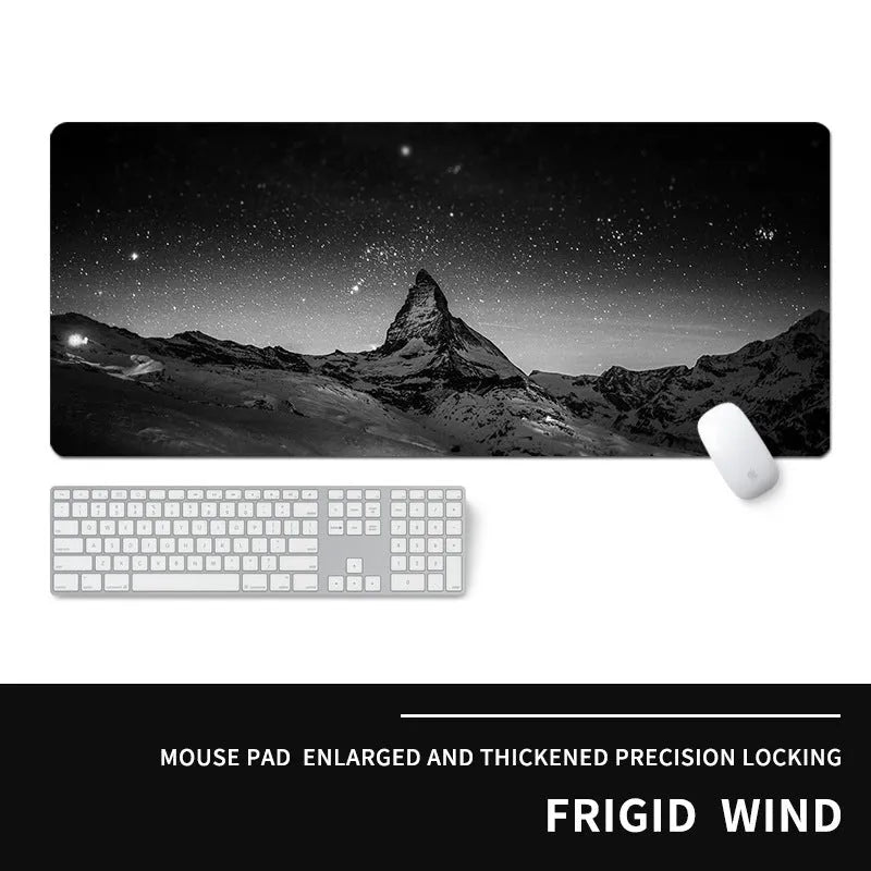 Oversized thick gaming mouse pad with printed e-sports design on a desk with keyboard and mouse.