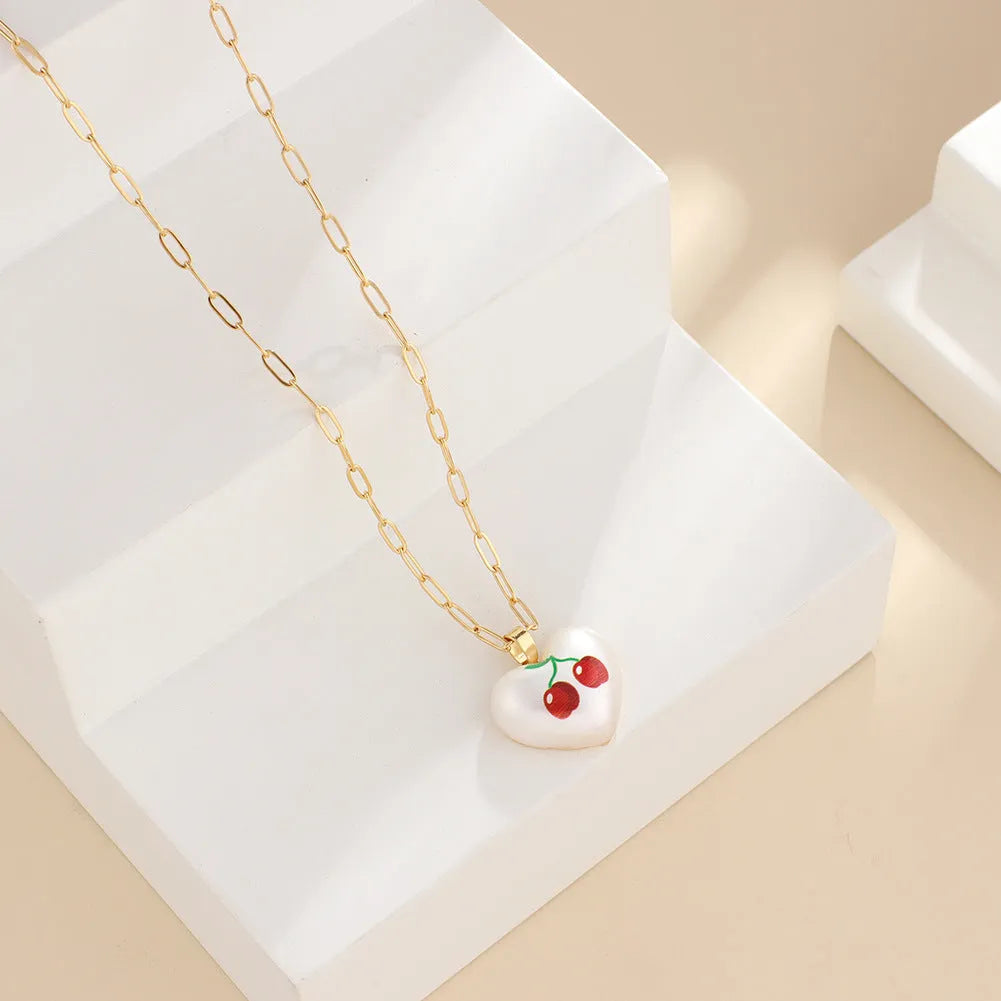 Silver tone heart necklace with geometric fruit pendant on adjustable 21-50cm chain