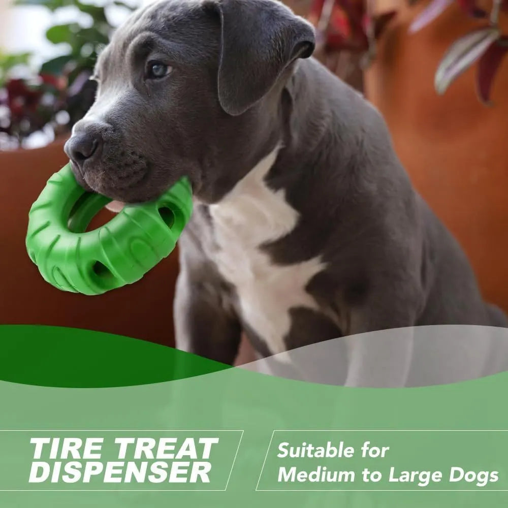 Blue rubber tire-shaped dog chew toy with oval openings, shown as a puzzle feeder for medium to large dogs.
