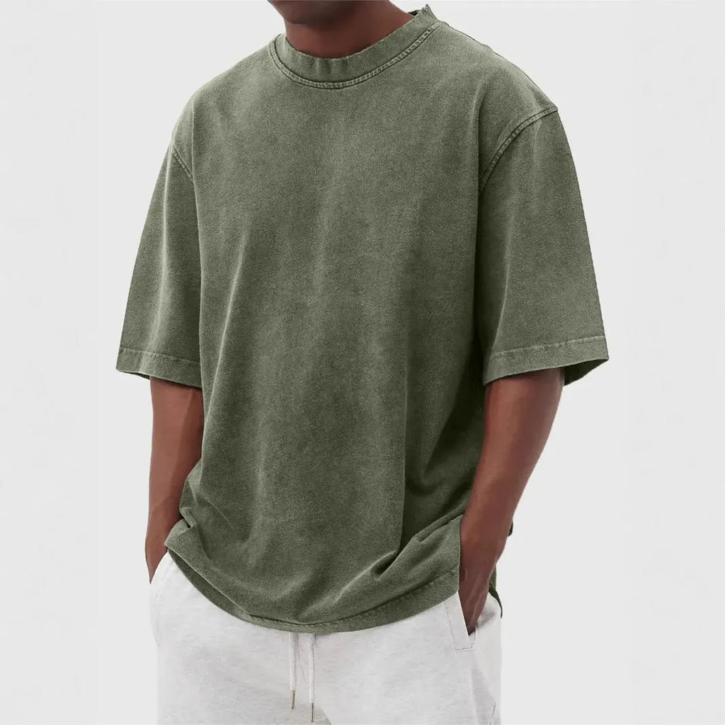 Men's loose fit distressed stone wash pullover t-shirt in solid colours like army green and blue.