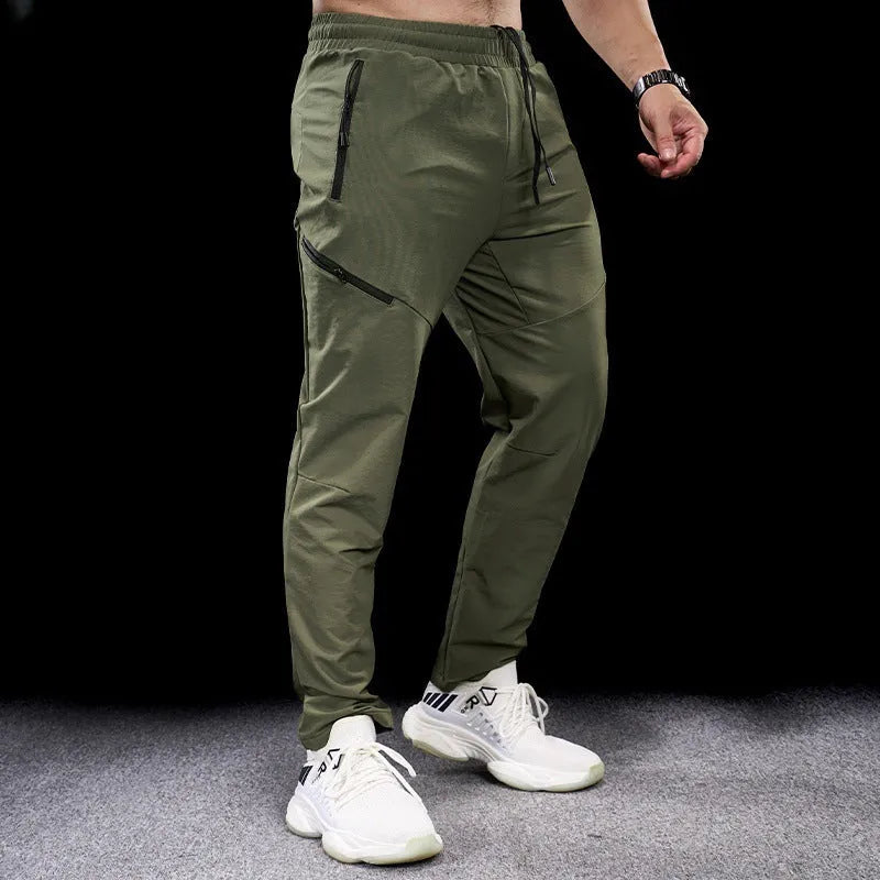 Men's waterproof quick-dry nylon exercise trousers in Army Green colour with mid waist design