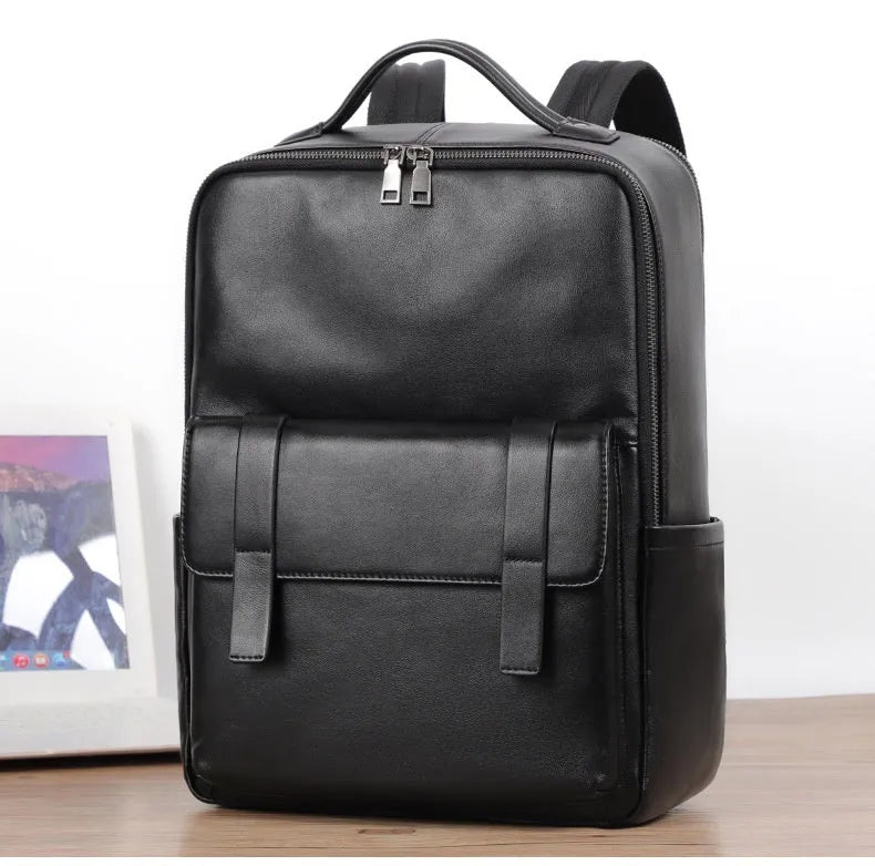 Black genuine leather men's computer backpack with a 36-55L capacity and contoured back plate.