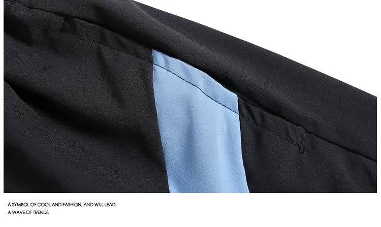 Loose-fit black sports shorts with elastic waistband and straight-leg design for training.