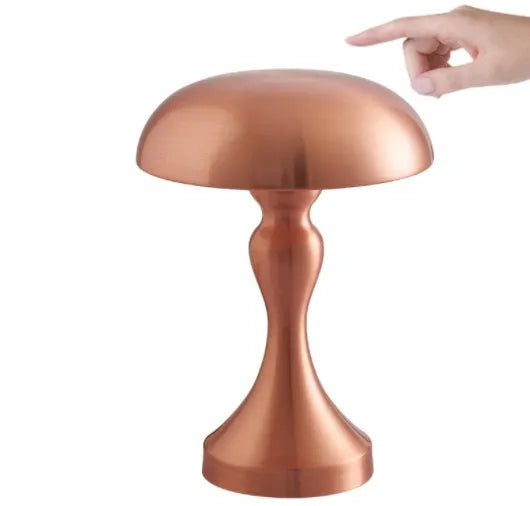 Bronze LED desk lamp with touch control showing three colour temperature settings on wooden desk