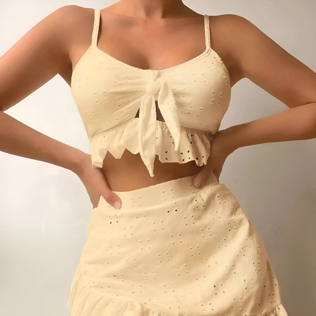 Women's solid colour three-piece skirt bikini swimsuit in polyester fabric.