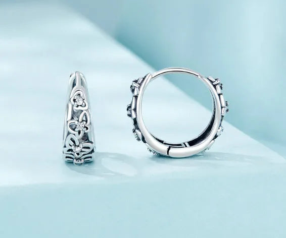 Sterling silver butterfly earrings with hollow design and zircon stone accents