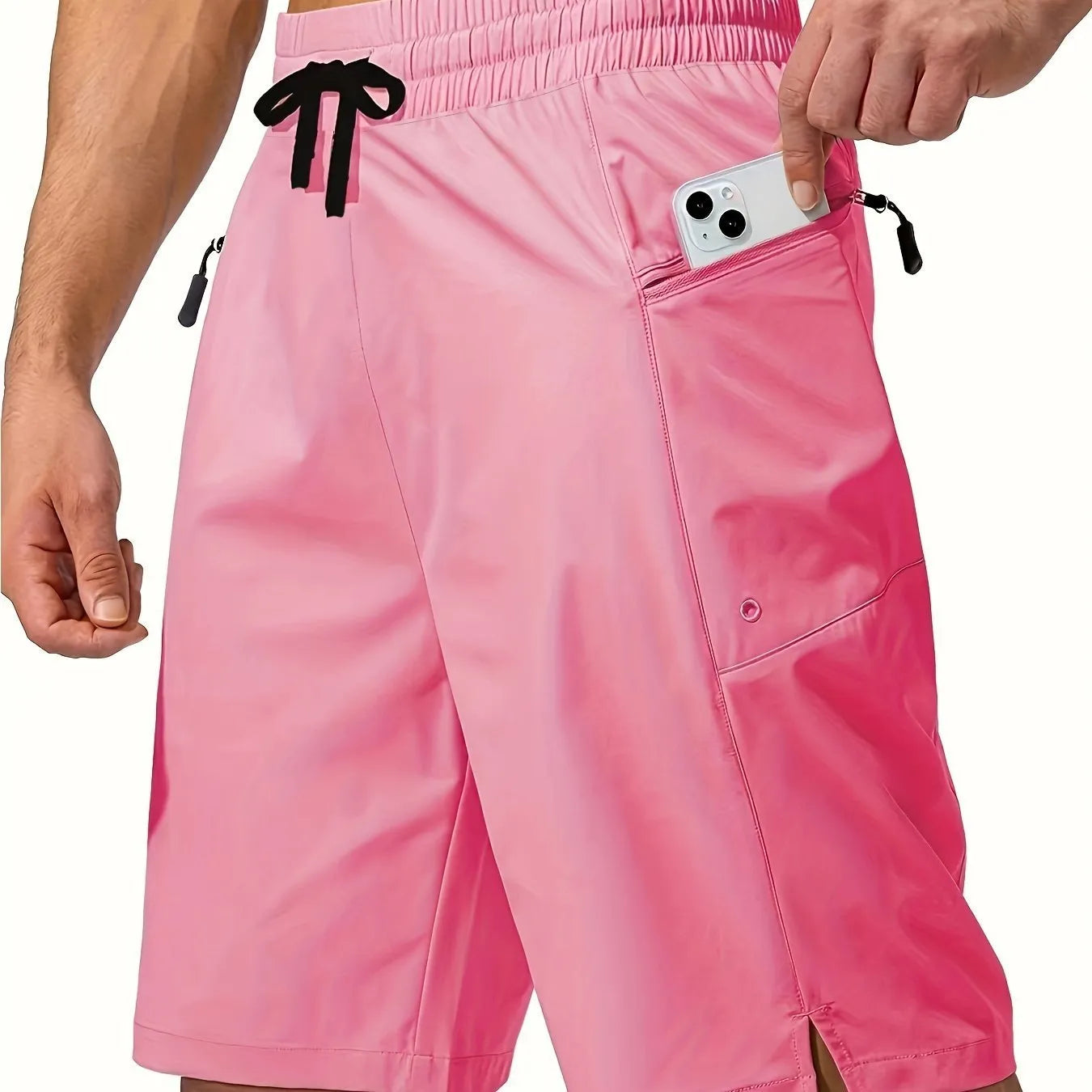 Man wearing straight cut quick-dry polyester beach shorts in a solid colour.