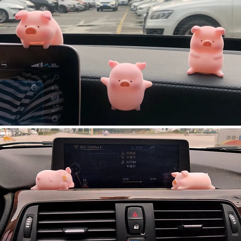 A cute resin cartoon pig figure car accessory for dashboard decoration.