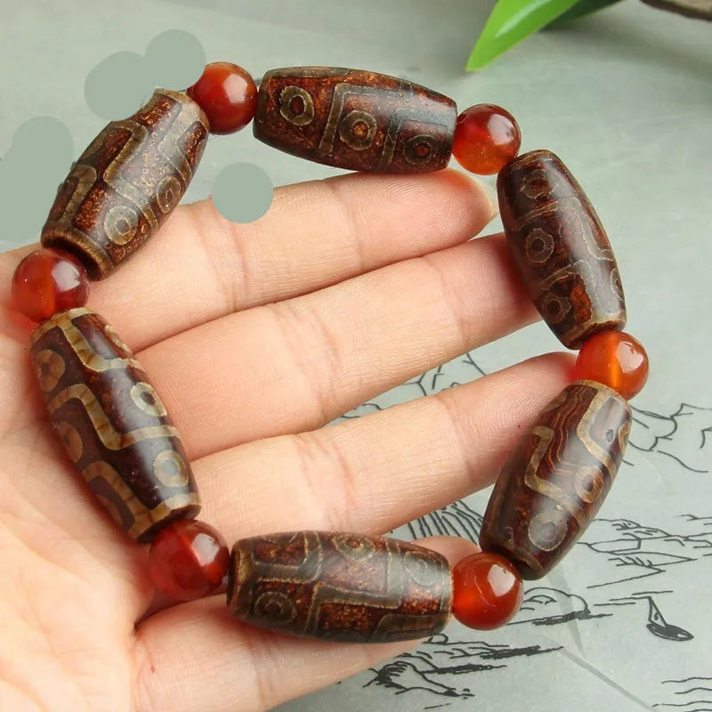 Agate Tibetan dzi bead bracelet with three-eye design and polished finish
