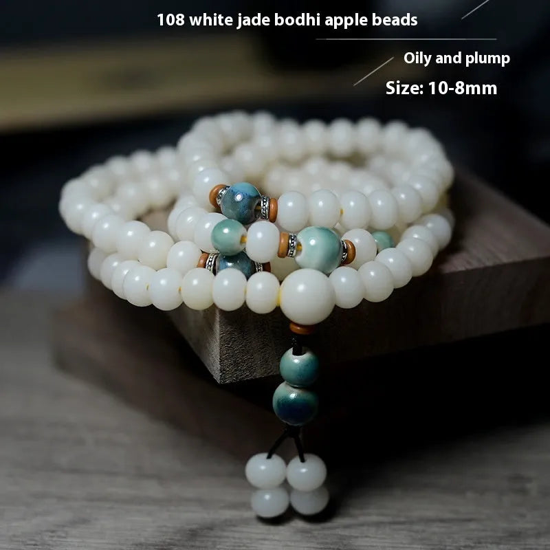 White jade bodhi seed bracelet with 108 flat round beads in 7x9mm and 8x10mm sizes.