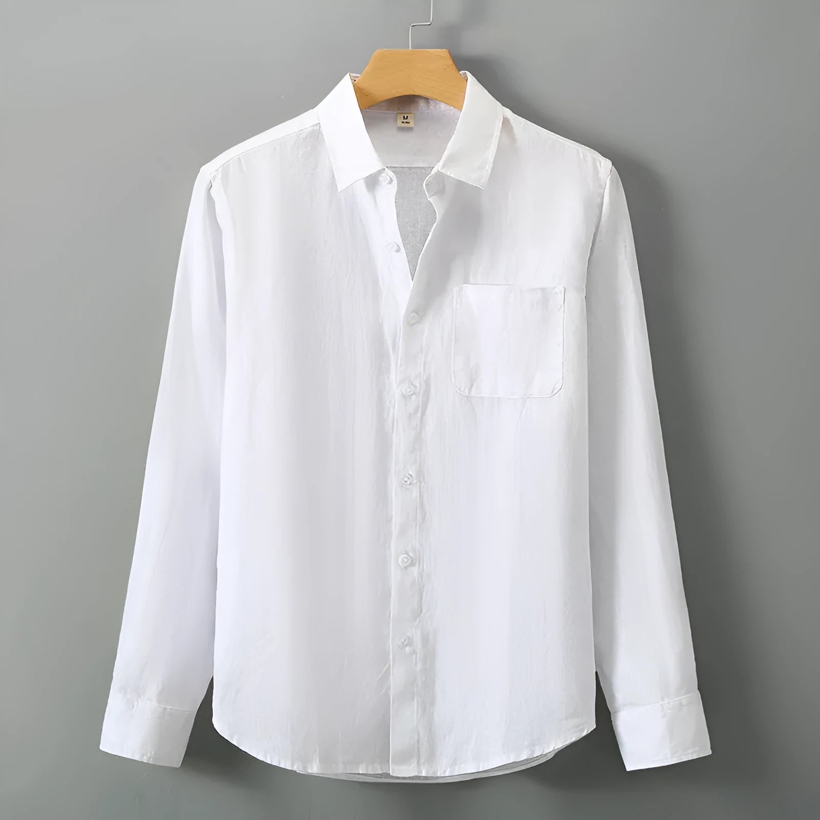 Long sleeve loose fit linen shirt in a solid colour, styled as a Chinese cardigan.