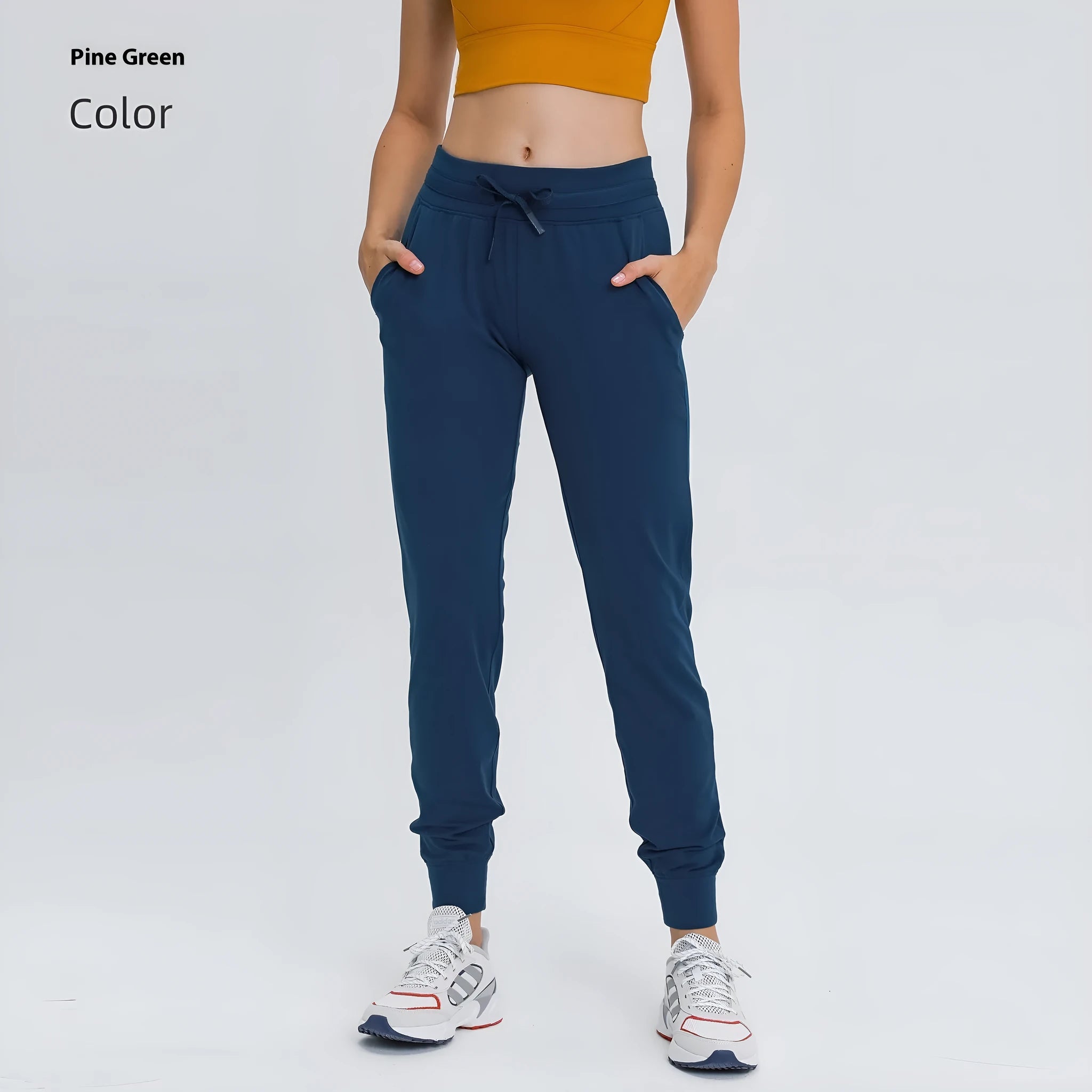 Women's high-waist yoga pants with drawstring waistband in distilled coffee colour, suitable for fitness.