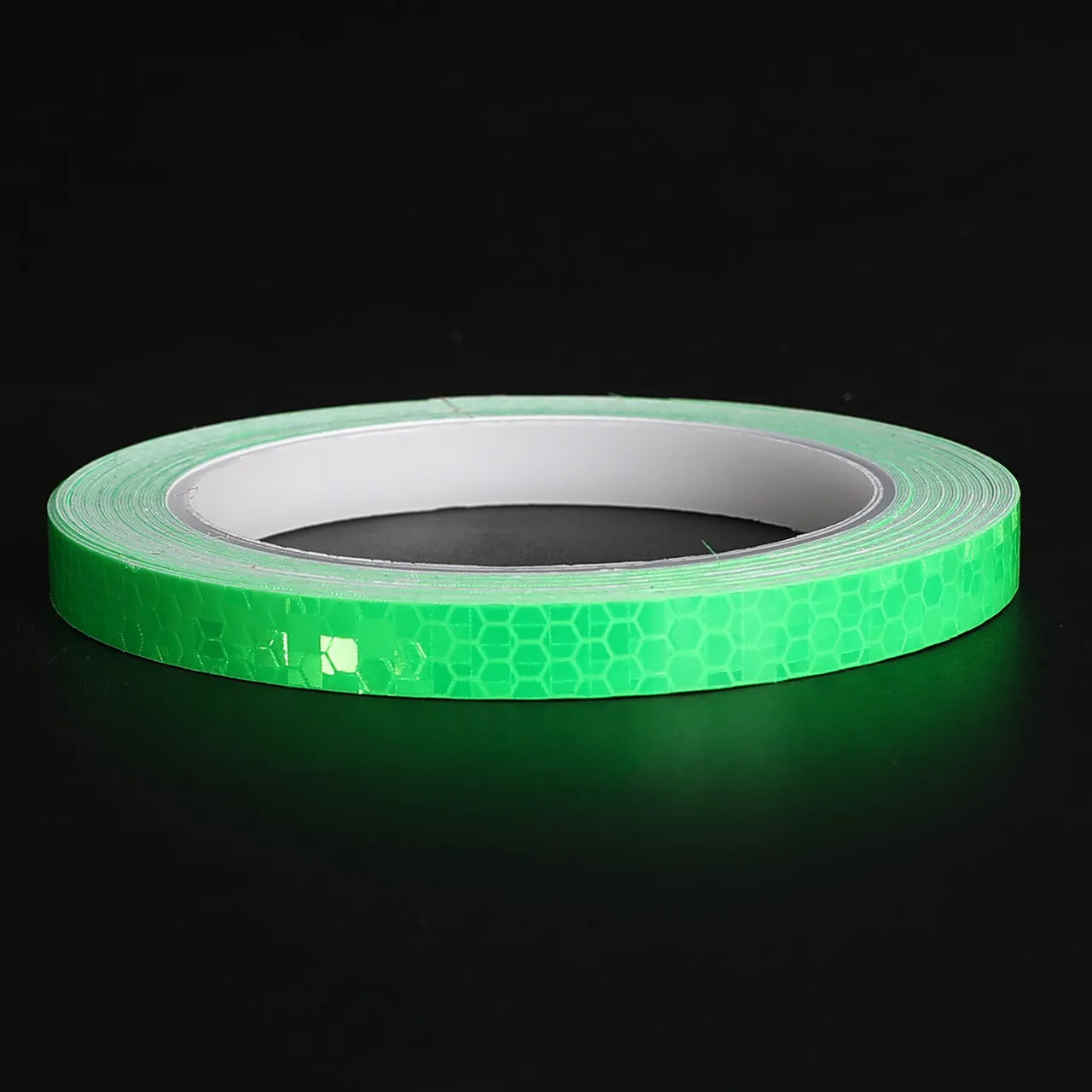 Close-up of solid colour reflective stripe roll with crystal lattice pattern, 10mm width, 8m length, in grass green colour.