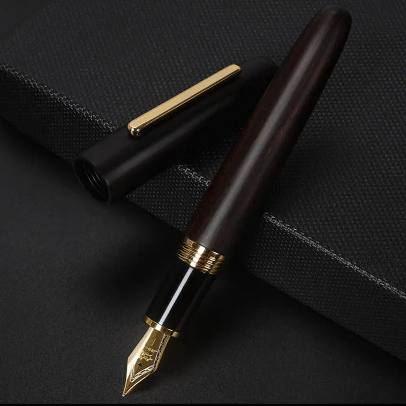 Wooden fountain pen with rotating cap showing natural wood grain