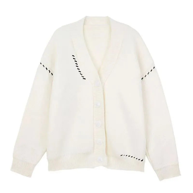 Women's loose fit black knitted cardigan coat with long sleeves.