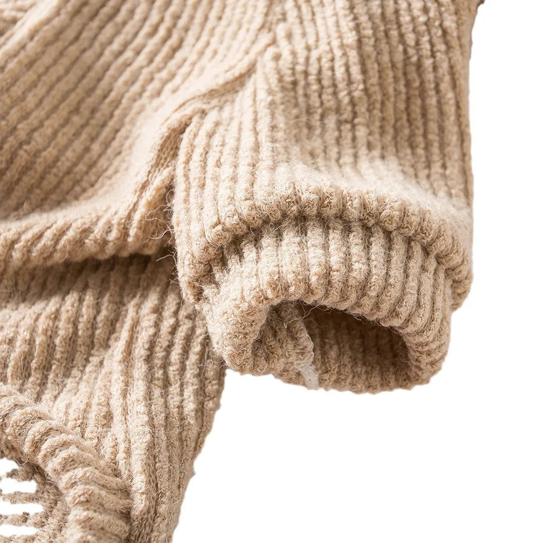 Brown knitted pullover sweater on a small dog, showing four-leg design for full coverage.