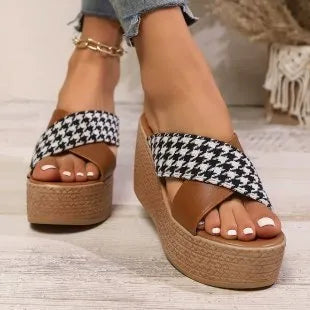 Casual brown plaid wedge sandals with a cross leopard pattern and a rubber sole.