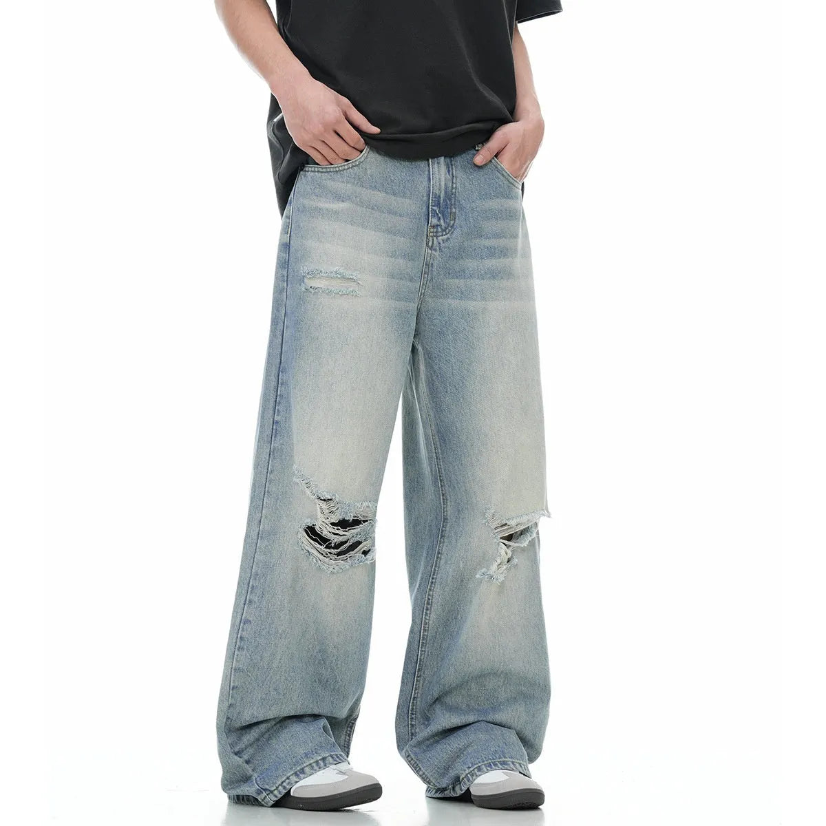 Men's blue straight-leg jeans with ripped details and zipper fly in retro style
