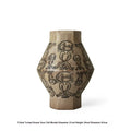Hand-painted ceramic vase with vintage carved religious patterns in tribal totem colours